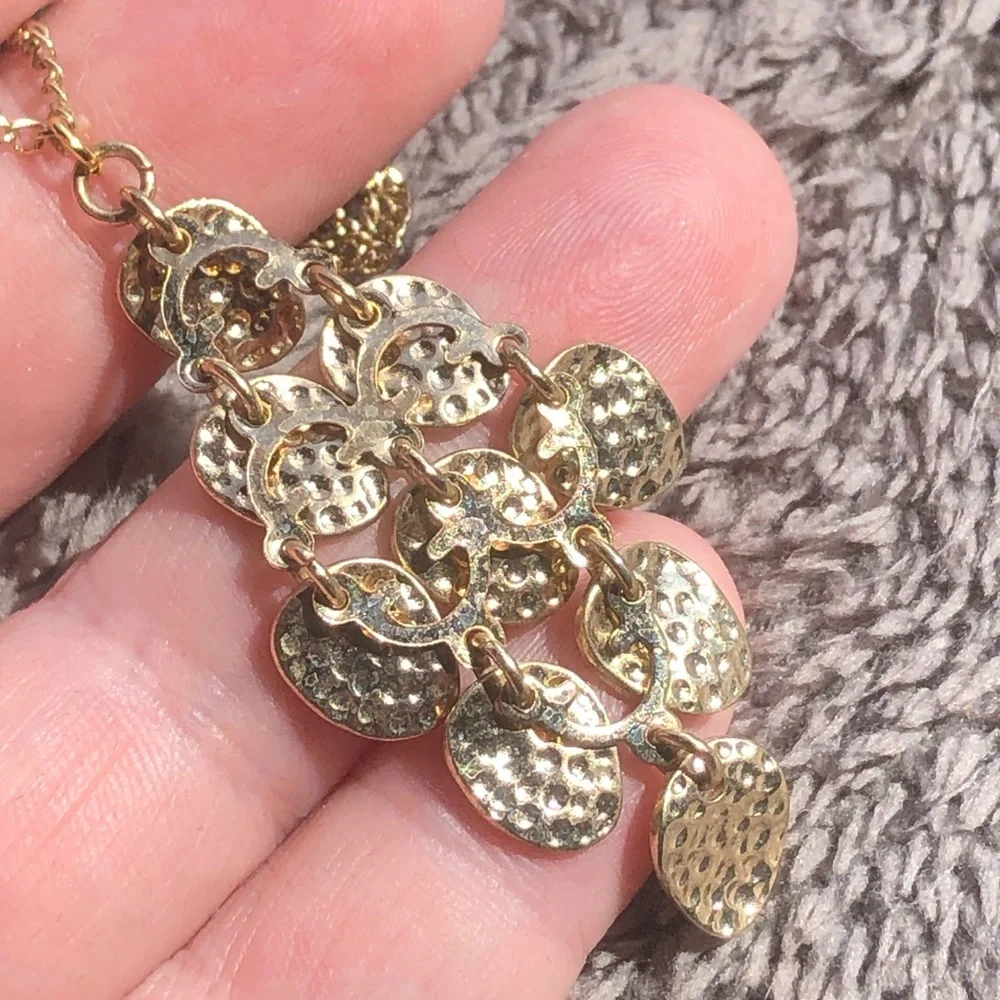 Shiny gold waterfall articulated pendant on chain necklace